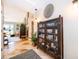 Inviting hallway featuring tile flooring, decorative shelving, and a glimpse into the living spaces at 6051 Twin Lakes Dr, Oviedo, FL 32765