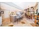Open kitchen boasts an island with seating, modern appliances, and dining area at 6051 Twin Lakes Dr, Oviedo, FL 32765
