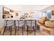Bright kitchen features a spacious island with seating, quartz countertops, and stainless steel appliances at 6051 Twin Lakes Dr, Oviedo, FL 32765