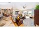 Open concept living room with a dining area and cozy seating, featuring plenty of natural light at 6051 Twin Lakes Dr, Oviedo, FL 32765