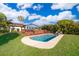 Backyard featuring a private pool, wooden deck, and lounge chairs at 6051 Twin Lakes Dr, Oviedo, FL 32765