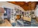Sunroom offers vaulted ceiling, natural light, built-in bookshelves, and workspace at 6051 Twin Lakes Dr, Oviedo, FL 32765
