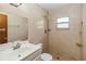 Tiled bathroom with large shower, modern fixtures, and stone floor at 612 California Ave, St Cloud, FL 34769