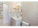 Updated bathroom with tile walls, modern fixtures, and ample vanity space at 612 California Ave, St Cloud, FL 34769
