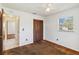 Comfortable bedroom featuring carpet flooring, ceiling fan, and ample closet space at 612 California Ave, St Cloud, FL 34769