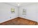 Bright bedroom with two windows offering natural light and comfortable carpet floors at 612 California Ave, St Cloud, FL 34769
