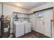 Laundry room with washer, dryer, and access to the exterior at 612 California Ave, St Cloud, FL 34769