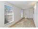 Bright sunroom with tile floor features two windows and a door to the exterior at 612 California Ave, St Cloud, FL 34769