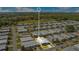 An aerial view features a charming mobile home within a well-maintained community, close to picturesque woods and a serene lake at 6462 Hollyberry Ne Ln, Winter Haven, FL 33881