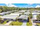 Aerial view of the community with well-maintained homes and manicured lawns, set against a lush landscape at 6462 Hollyberry Ne Ln, Winter Haven, FL 33881
