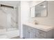 Updated bathroom features marble-style shower, vanity, and modern fixtures at 6462 Hollyberry Ne Ln, Winter Haven, FL 33881