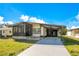 Inviting single-story home boasts a covered carport and screened-in porch at 6462 Hollyberry Ne Ln, Winter Haven, FL 33881