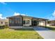 Charming single-story home featuring a covered carport and screened-in porch area at 6462 Hollyberry Ne Ln, Winter Haven, FL 33881