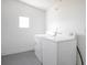 Laundry room featuring a washer and dryer and a bright, clean space at 6462 Hollyberry Ne Ln, Winter Haven, FL 33881