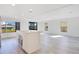 Bright and airy living room with laminate floors, recessed lighting, and modern island at 6462 Hollyberry Ne Ln, Winter Haven, FL 33881
