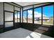 Enclosed sunroom with ample windows offering neighborhood views at 6462 Hollyberry Ne Ln, Winter Haven, FL 33881
