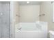 Bathroom with tiled shower, soaking tub and tiled surround at 6495 Fall St, St Cloud, FL 34771