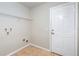 The functional laundry room has tile floor, a door to the outside, and plenty of room at 6495 Fall St, St Cloud, FL 34771