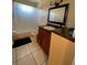 Bathroom featuring granite counters and tiled floors at 723 Michigan Ct # 3, St Cloud, FL 34769