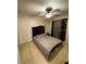 Relaxing bedroom with a dark headboard, neutral colors, and a ceiling fan at 723 Michigan Ct # 3, St Cloud, FL 34769