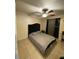 Relaxing bedroom with a dark headboard, neutral colors, and a ceiling fan at 723 Michigan Ct # 3, St Cloud, FL 34769