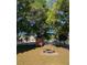 Community picnic area with mature trees offering shade at 723 Michigan Ct # 3, St Cloud, FL 34769