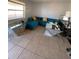 Bright living room with teal sectional couch at 723 Michigan Ct # 3, St Cloud, FL 34769