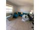 Bright living room with teal sectional couch at 723 Michigan Ct # 3, St Cloud, FL 34769