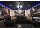 Spacious basement with comfortable seating and lively entertainment options, including a pool table and arcade games at 7570 Excitement Dr, Reunion, FL 34747