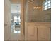 Modern bathroom showcasing tiled shower and clear view to outdoor living area at 7570 Excitement Dr, Reunion, FL 34747