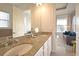 Bathroom boasting double sinks and granite counters near soaking tub at 7570 Excitement Dr, Reunion, FL 34747