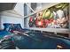 A bedroom with Marvel Avenger's themed wallpaper and decor at 7570 Excitement Dr, Reunion, FL 34747