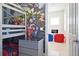 Whimsical themed bedroom with bunk beds and a cozy seating area, perfect for children at 7570 Excitement Dr, Reunion, FL 34747