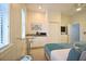 Cozy guest suite featuring kitchenette, twin beds and ample natural light at 7570 Excitement Dr, Reunion, FL 34747