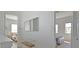 Bright hallway with a mirror and views into bedrooms on either side at 7570 Excitement Dr, Reunion, FL 34747