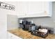 Well-appointed kitchen features stainless steel appliances and a charming coffee bar setup on the granite countertop at 7570 Excitement Dr, Reunion, FL 34747
