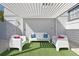 Relaxing outdoor space with plush seating and overhead trellis offering shade and style at 7570 Excitement Dr, Reunion, FL 34747