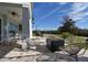 Enjoy outdoor gatherings in this inviting patio featuring stylish seating and a modern fire pit at 7570 Excitement Dr, Reunion, FL 34747