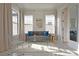 Living area features a comfortable sofa with decorative pillows and a glass coffee table at 7570 Excitement Dr, Reunion, FL 34747