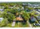 An aerial view shows the neighborhood, highlighting proximity to the community amenities, including the lake at 815 Kentucky Ave, St Cloud, FL 34769