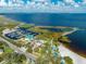 Expansive aerial view showcasing a marina, lakefront park, splashpad, and playground at 815 Kentucky Ave, St Cloud, FL 34769