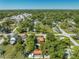 Aerial view of the property in a neighborhood with mature trees, showcasing its location and surrounding community at 815 Kentucky Ave, St Cloud, FL 34769