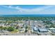 Aerial view of a city with commercial buildings and tree-lined streets on a clear, sunny day at 815 Kentucky Ave, St Cloud, FL 34769