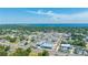 Panoramic aerial view of a city, showcasing commercial buildings, waterfront, and lush greenery at 815 Kentucky Ave, St Cloud, FL 34769