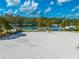 Aerial view of a sandy beach featuring a playground and splash pad area with beach volleyball in the foreground at 815 Kentucky Ave, St Cloud, FL 34769