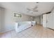 Versatile bedroom featuring daybeds, a ceiling fan, and laundry appliances offering comfort and practical amenities at 815 Kentucky Ave, St Cloud, FL 34769