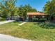 Charming single-story home with well-manicured lawn and mature trees providing curb appeal at 815 Kentucky Ave, St Cloud, FL 34769