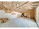 Expansive garage with white walls and a sliding glass door, offering a bright space ready for customization and storage at 815 Kentucky Ave, St Cloud, FL 34769