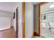 Hallway view showing entry to bathroom featuring a vanity and tile flooring at 815 Kentucky Ave, St Cloud, FL 34769