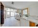 Bright kitchen with stainless steel appliances and white cabinets, ready for renovation at 815 Kentucky Ave, St Cloud, FL 34769
